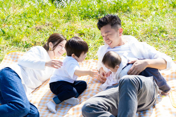 istock Parents and children enjoying a picnic 1309936233