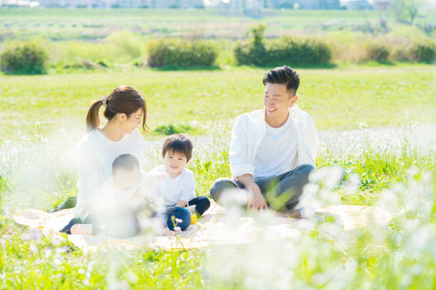 istock Parents and children enjoying a picnic 1309936252