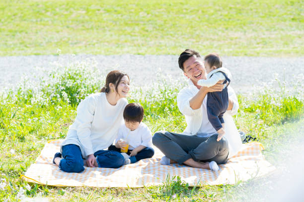 istock Parents and children enjoying a picnic 1309936320