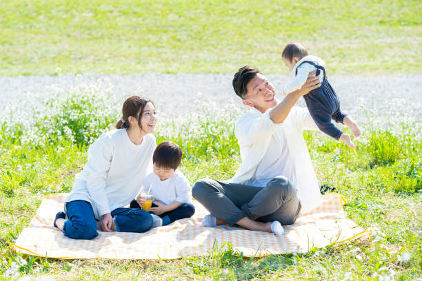 istock Parents and children enjoying a picnic 1309936382