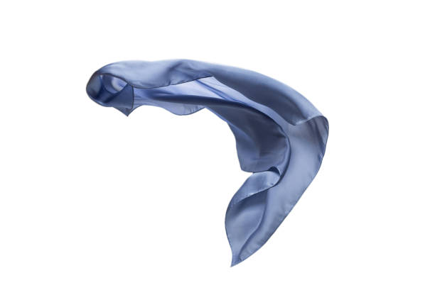 istock Flowing blue silk scarf isolated on white background. 1309936389