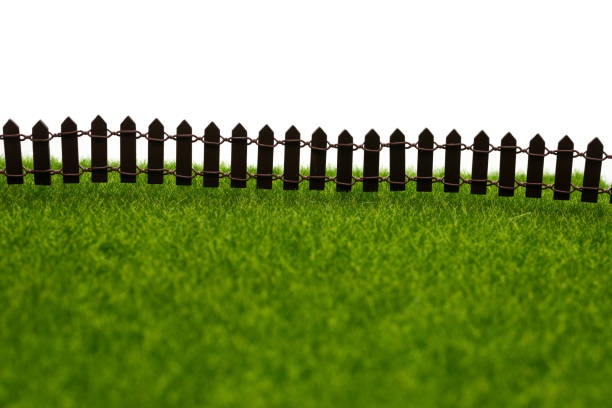 Close up blue wooden fence over sunny blue clear sky with white clouds