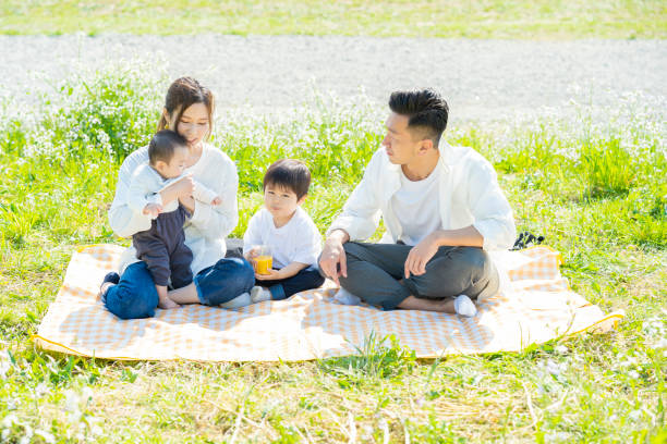 istock Parents and children enjoying a picnic 1309936448