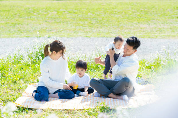 istock Parents and children enjoying a picnic 1309937103