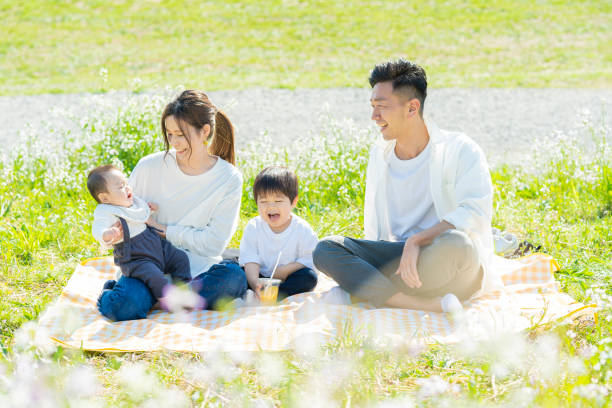 istock Parents and children enjoying a picnic 1309937214