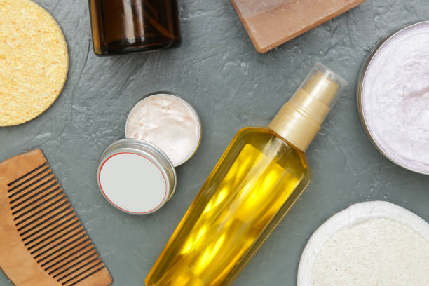 istock Various toiletries on textured gray background, top view 1309940883