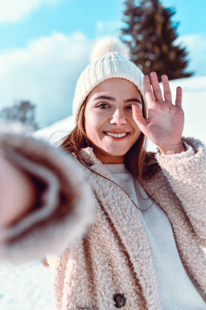 istock Selfie Time For Waving Female Spending Day In Mountain Snow 1309941518