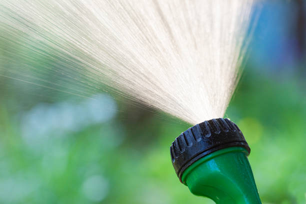 istock Lawn sprinkler spaying water closeup 1309941961