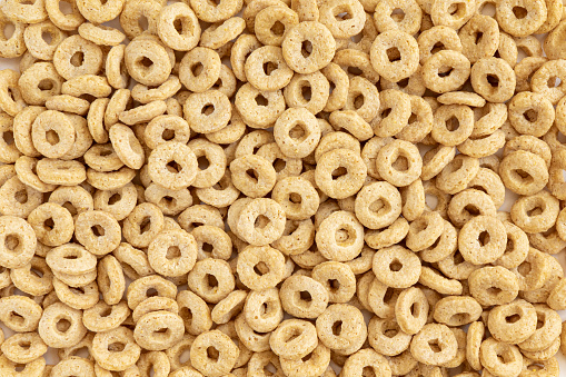 delicious cheerios oat cereal in large pile, cereal cheerios background, delicious and useful breakfast