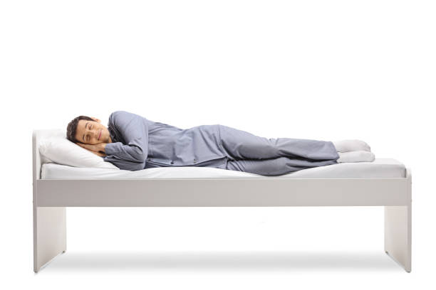 istock Full length shot of a man sleeping peacfully in a single bed 1309945255