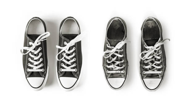 istock New and old black sneakers isolated on white background 1309946148