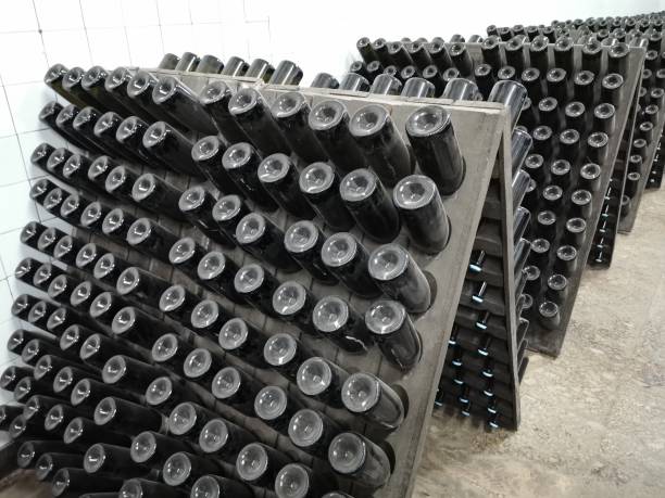 istock Champagne bottle production in winery cellar 1309946287