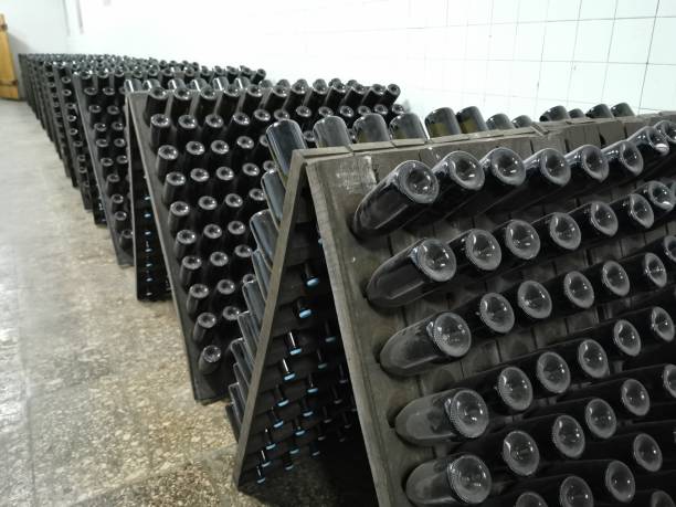 istock Champagne bottle production in winery cellar 1309946316