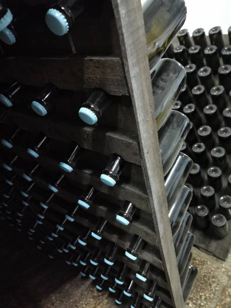 istock Champagne bottle production in winery cellar 1309946318