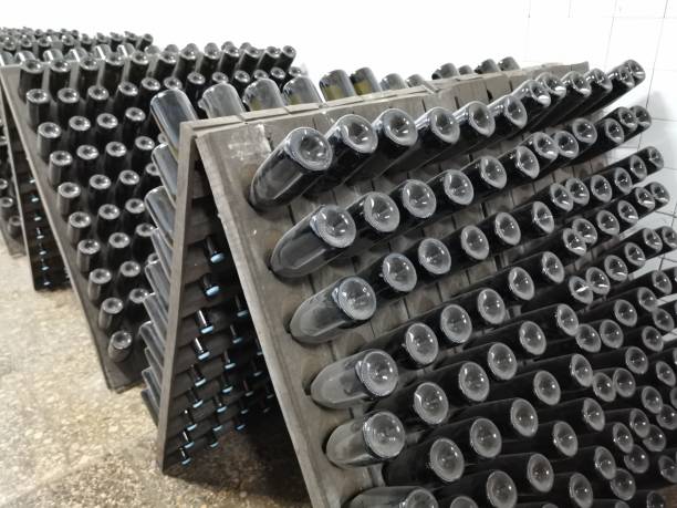 istock Champagne bottle production in winery cellar 1309946392