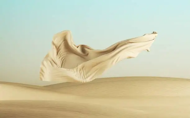 Photo of 3d render, fashion drapery falls down, silk fabric levitates above the ground, abstract modern minimal background with flying textile cloth on a desert landscape with sand dunes