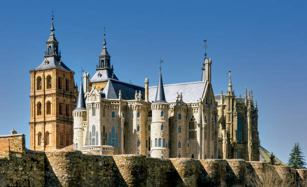 View of historic cathedral, Gaudi building and ancient Roman wall in Astorga, Spain. stock photo