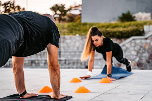 istock Man and a woman working out by the river 1309949167