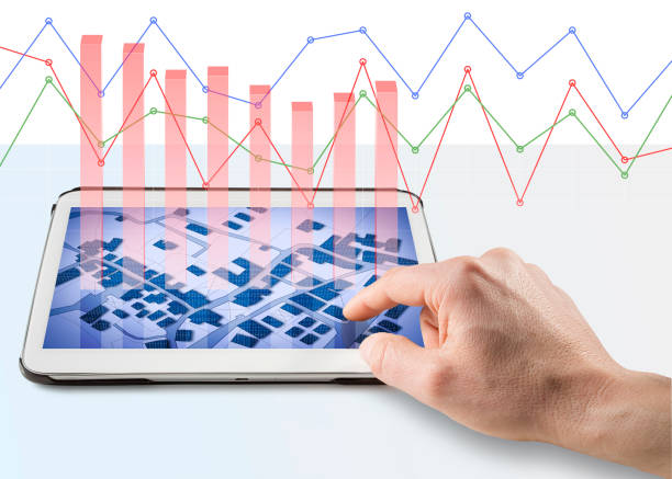 istock Land registry concept image with an imaginary cadastral map of territory on a digital tablet with graph 1309950309