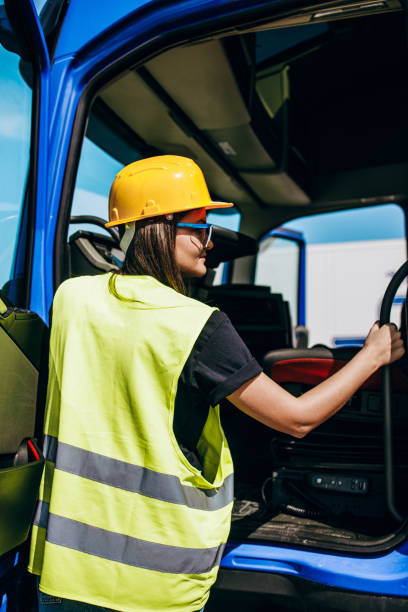 istock Professional happy female truck driver working 1309951357