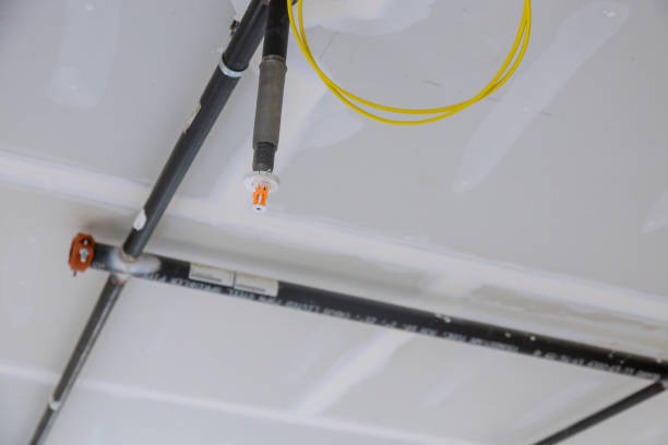 istock Fire fighter safety fighting equipment sprinkler on ceiling automatic head extinguisher selected focus sprinkle 1309952540