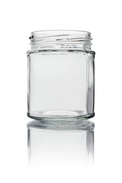 istock An empty glass jar without a lid. Close-up, isolated on a white background with reflection. 1309952660