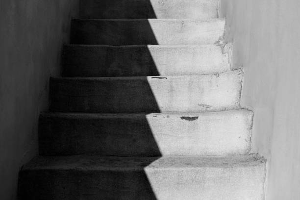 istock Stairway outdoor with sunlight and diagonal shadow, black and white, Sicily 1309954754