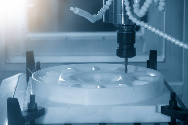 istock The  CNC  milling machine cutting  the POM material part by solid ball  end-mill tool. 1309955029