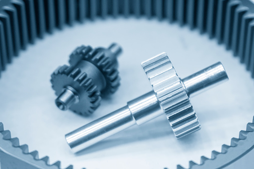 Close-up scene of planetary gear  gear part in the light blue scene. The automatic transmission part manufacturing concept.