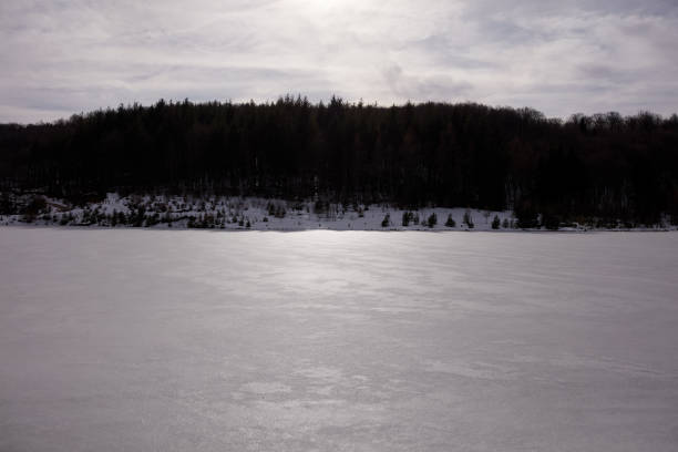istock Frozen water surface of a lake. 1309955435