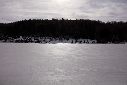 Frozen water surface of a lake.