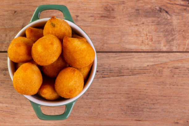 traditional Brazilian fried snack stuffed with chicken traditional Brazilian fried snack stuffed with chicken. coxinha stock pictures, royalty-free photos & images