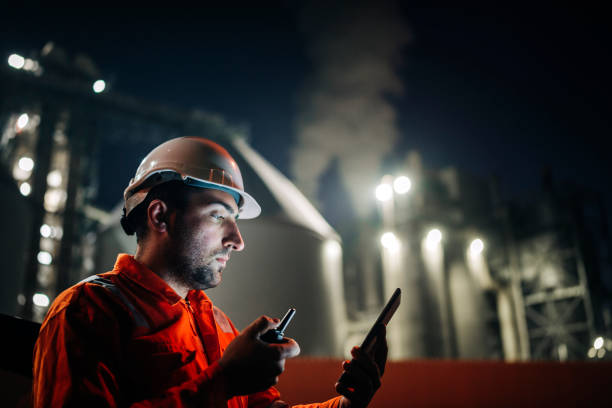 istock Engineer use digital tablet to expertise petroleum industrial factory at night 1309959021