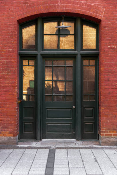 istock tall window in the middle of a brick wall 1309959288