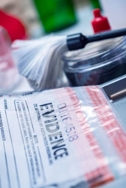 istock Basic research utensilios with a evidence bag in Laboratorio forensic equipment, conceptual image 1309959465