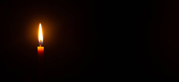 istock close up candle light in the dark macro photography texture background 1309960653