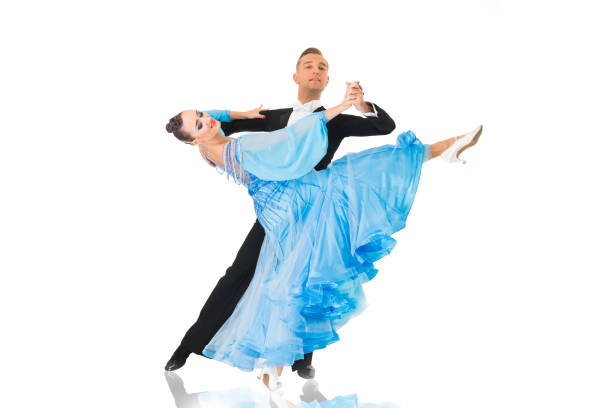 istock ballrom dance couple in a dance pose isolated on black background 1309961045