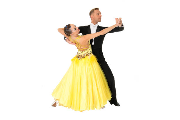 istock ballrom dance couple in a dance pose isolated on black background 1309961146
