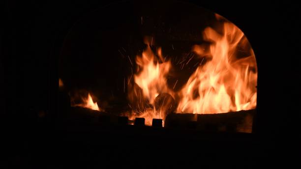 istock Blurry burning flame with sparks inside rustic furnace 1309961937