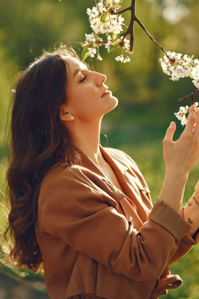 istock Stylish woman spending time in a spring park 1309963757