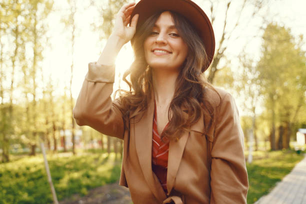 istock Stylish woman spending time in a spring park 1309964330