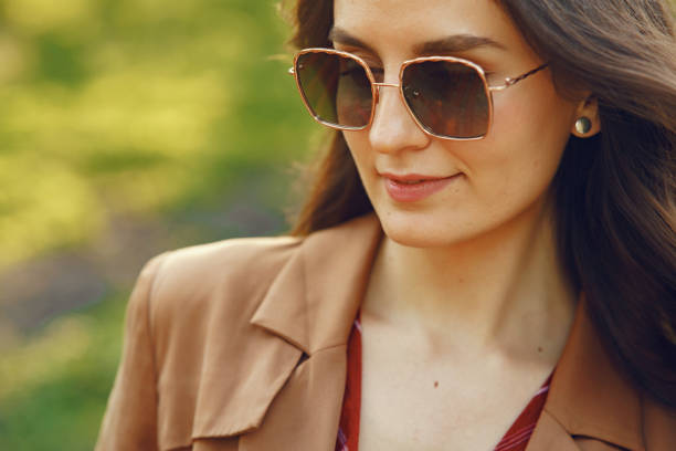 istock Stylish woman spending time in a spring park 1309964346