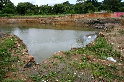 itabuna, bahia, brazil - february 15, 2012: accumulation of rainwater is seen in a excavated site for the construction of a building in the city of Itabuna, in southern Bahia.