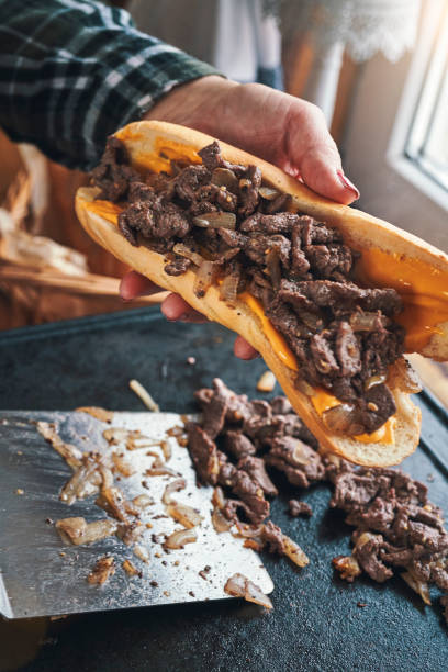 istock Preparing Chili Cheese Steak Sandwich Philly Style 1309966463