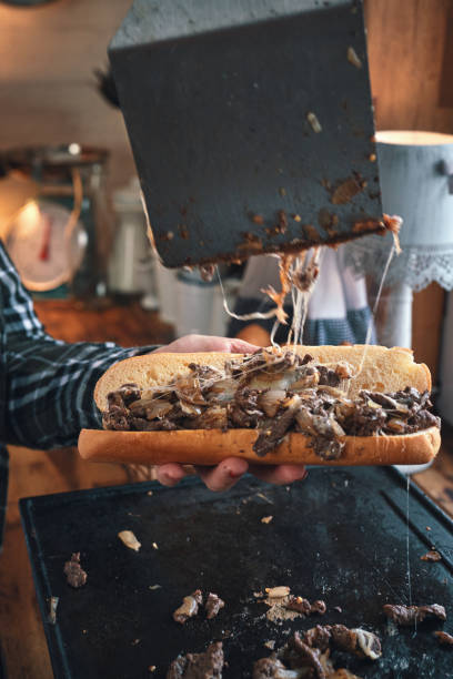 istock Preparing Chili Cheese Steak Sandwich Philly Style 1309967157