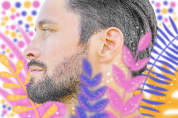 istock Man's artistic profile portrait with defocused floral illustration 1309967803