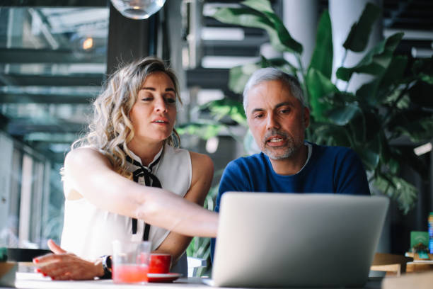 istock Coworkers discussing work in the office 1309969153