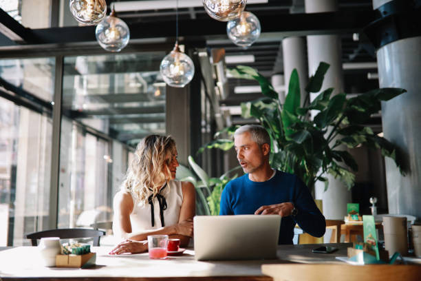 istock Coworkers discussing work in the office 1309969881