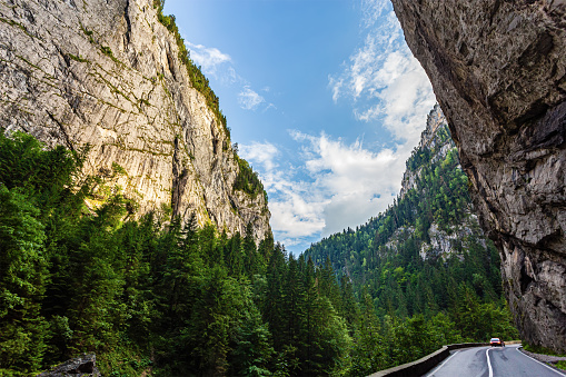 Road through the Bicaz Gorges seen during a beautiful summer day. Photo taken on 20th of August 2020 in the Carpathians Mountains, Romania.