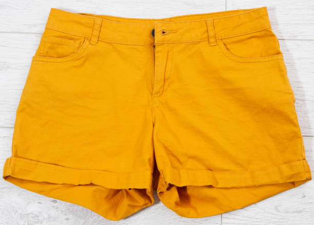 istock orange shorts close up top view shorts background 1309969956